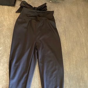 Brand New Never used. Med. Black dress leggings, ties in the back to make a bow.